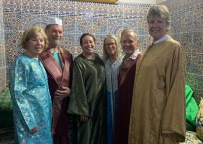 a group visits a family in fes